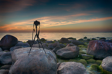 Image showing Camera on tripod near a sea