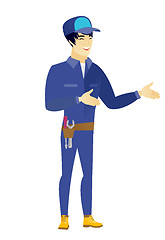 Image showing Young asian happy mechanic gesturing.