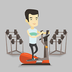 Image showing Man exercising on elliptical trainer.