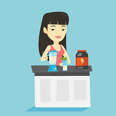 Image showing Young woman making protein cocktail.