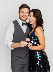 Image showing happy couple with cupcake at birthday party