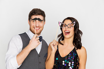 Image showing happy couple with party props having fun