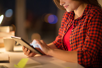 Image showing close up of student woman with tablet pc at home