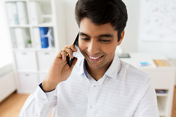 Image showing businessman calling on smartphone at office