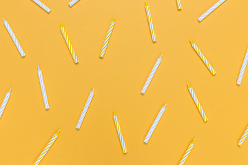 Image showing Birthday candles on bright yellow background