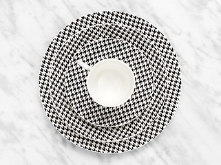 Image showing Coffee cup with a set of saucers on marble background