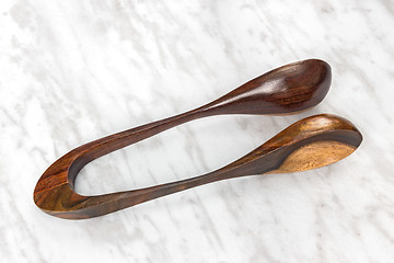 Image showing Wooden musical spoons on marble background