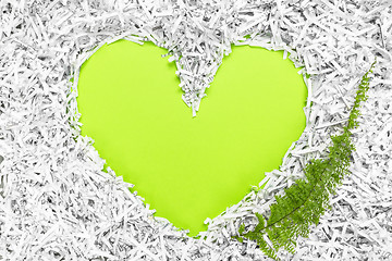 Image showing Heart frame made of shredded paper and a green leaf