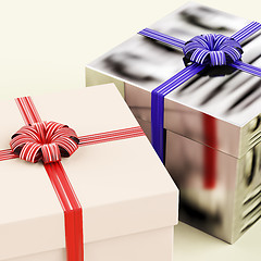 Image showing Two Gift Boxes With Blue And Red Ribbons As Presents For Him And