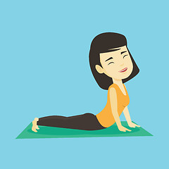 Image showing Woman practicing yoga upward dog pose.