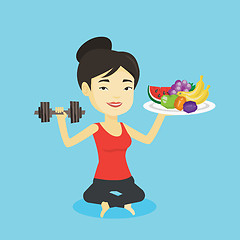 Image showing Healthy woman with fruits and dumbbell.