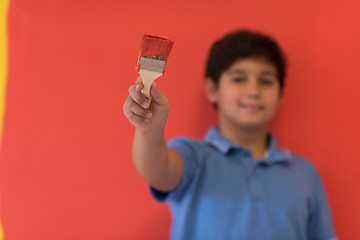 Image showing Portrait of a happy young boy painter