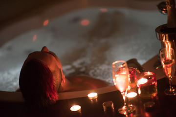 Image showing man relaxing in the jacuzzi