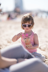 Image showing Mom and daughter on the beach