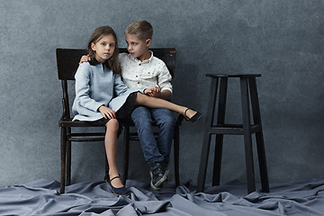 Image showing A portrait of little girl and a boy on the gray background