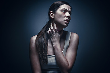 Image showing Close up portrait of a crying woman with bruised skin and black eyes