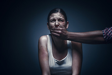 Image showing Man covering young woman\'s mouth