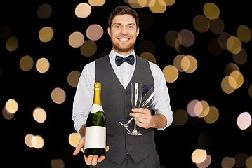 Image showing man with bottle of champagne and glasses at party