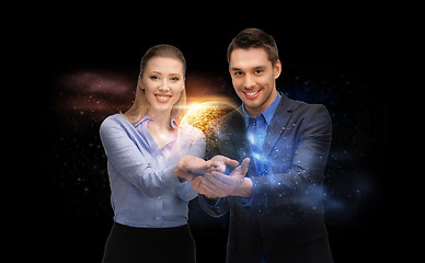 Image showing businessman and businesswoman over space