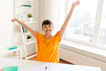 Image showing asian student girl celebrating success at home