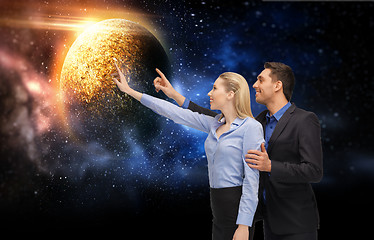 Image showing businessman and businesswoman over space