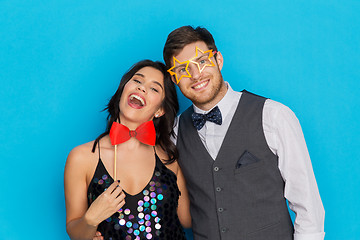 Image showing happy couple with party props having fun