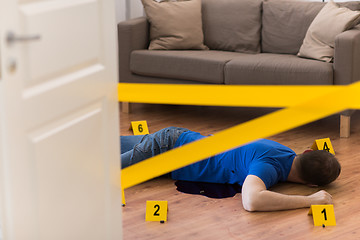 Image showing dead man body in blood on floor at crime scene