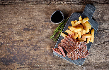 Image showing grilled beef steak and potatoes