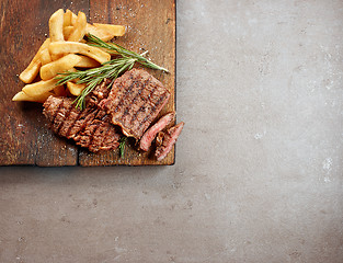 Image showing grilled beef steak and potatoes