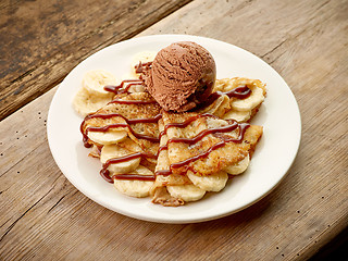 Image showing Crepes with banana and chocolate ice cream