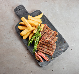 Image showing grilled beef steak and potatoes