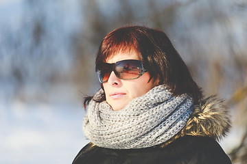 Image showing woman with sunglasses without makeup in winter time