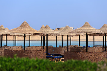 Image showing Beach sun parasol and blue sky, holliday in Egypt