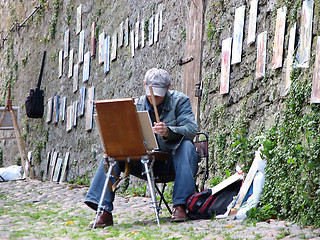 Image showing An artist at his work