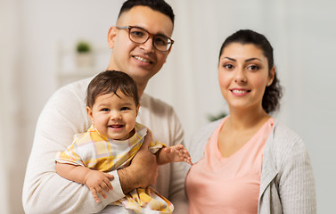 Image showing happy family with baby daughter at home