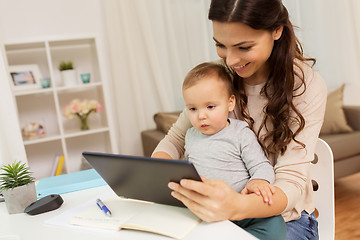 Image showing mother student with baby and tablet pc at home