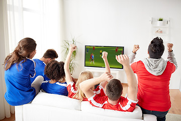 Image showing friends or soccer fans watching game on tv at home