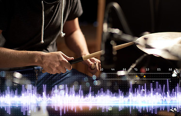 Image showing drummer playing drum kit at sound recording studio