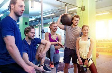 Image showing group of friends with sports equipment in gym