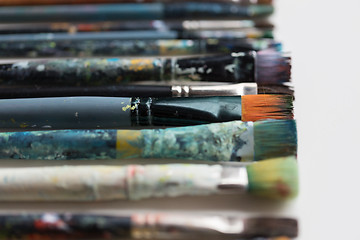 Image showing close up of dirty paintbrushes