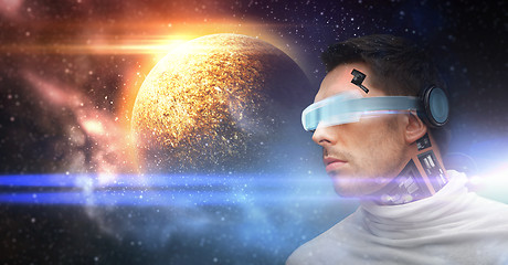 Image showing male robot in 3d glasses and sensors over space