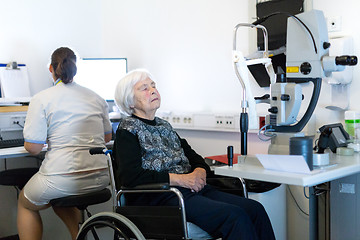 Image showing Senior woman beeing prepered for laser surgery at ophthalmology clinic.