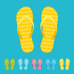 Image showing Row of colorful beach flip flops over color background