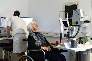 Image showing Senior woman beeing prepered for laser surgery at ophthalmology clinic.