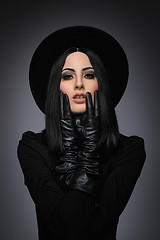 Image showing Beautiful High Fashion Model Wearing Black Hte and Leather Glove