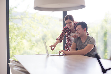 Image showing happy young couple buying online