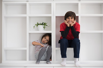 Image showing young boys posing on a shelf