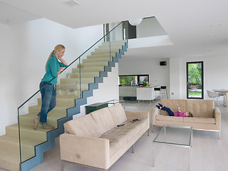 Image showing portrait of a young beautiful woman on the stairs