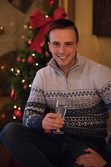 Image showing Happy young man with a glass of champagne