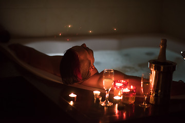 Image showing man relaxing in the jacuzzi